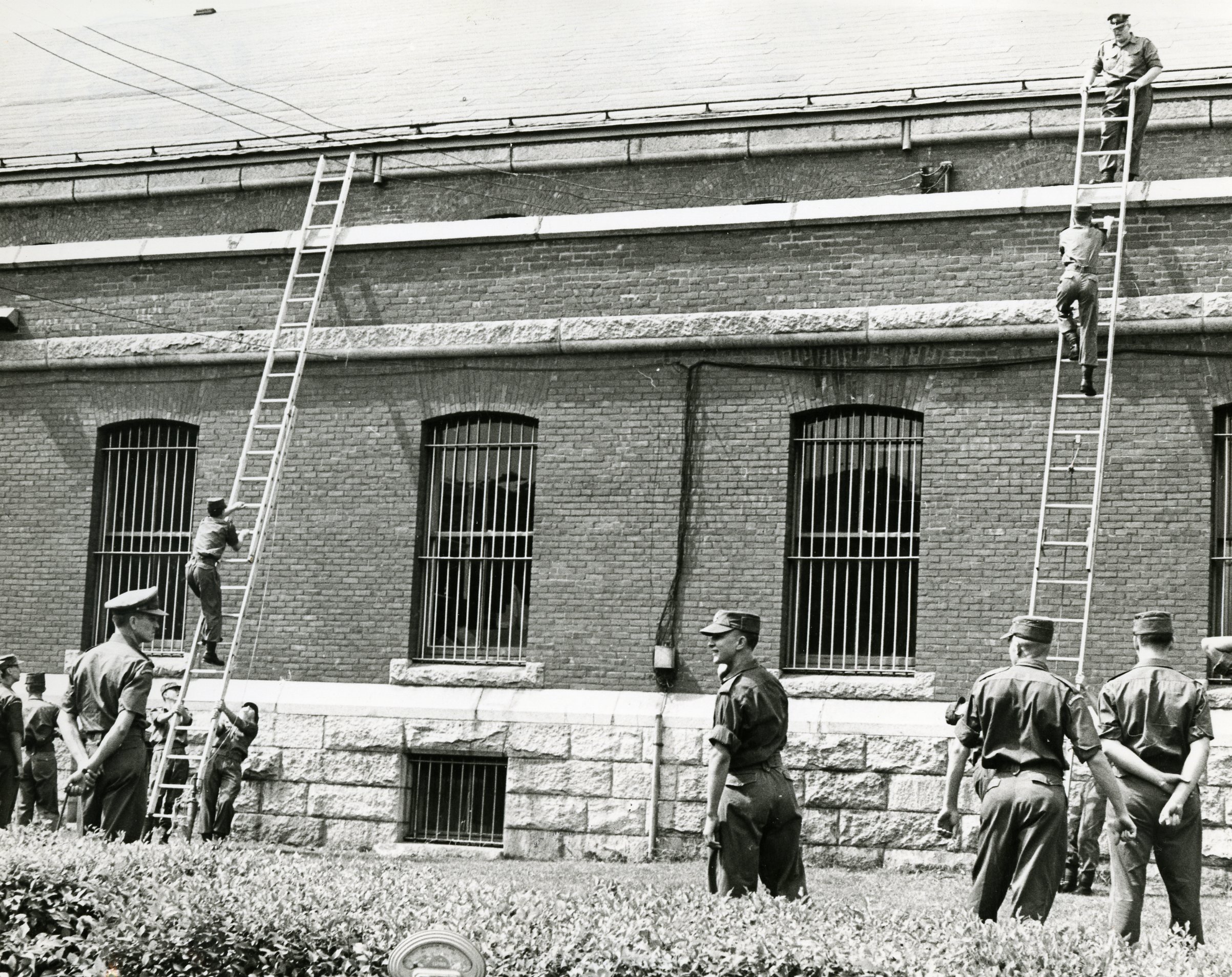 A group of soldiers outside a buildingDescription automatically generated with low confidence